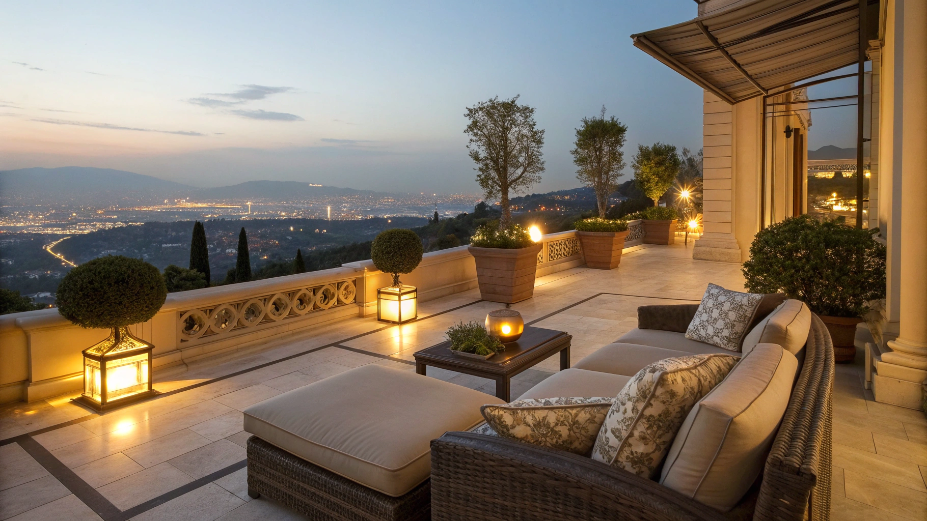 Private oceanfront suite terrace overlooking the calm sea at dusk